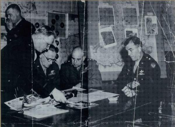 The only known surviving photograph from inside the underground operations room during the war.  In the centre is General James H Doolittle, commander of the US Eighth Air Force. 